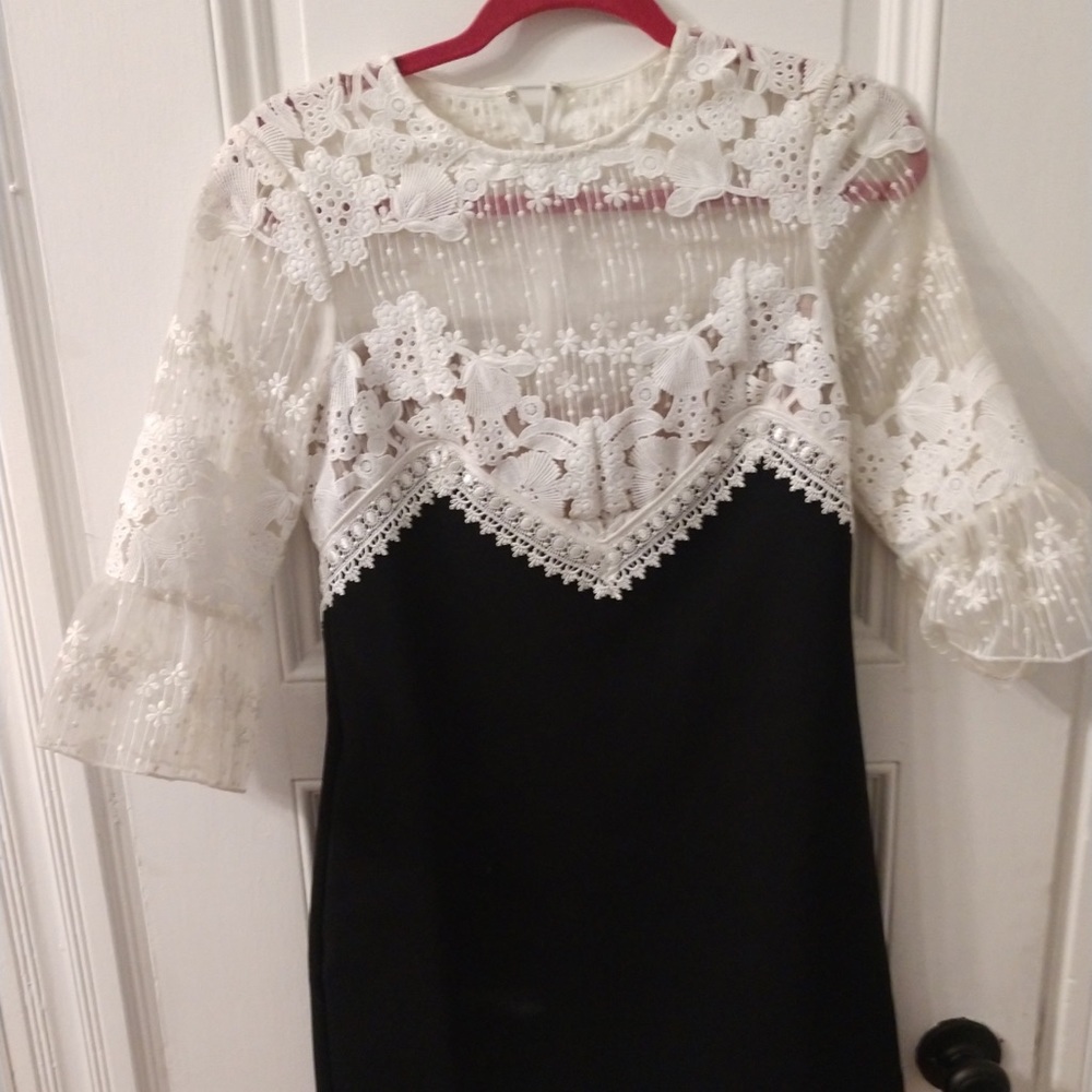Self Portrait Black and white lace adorned dress.